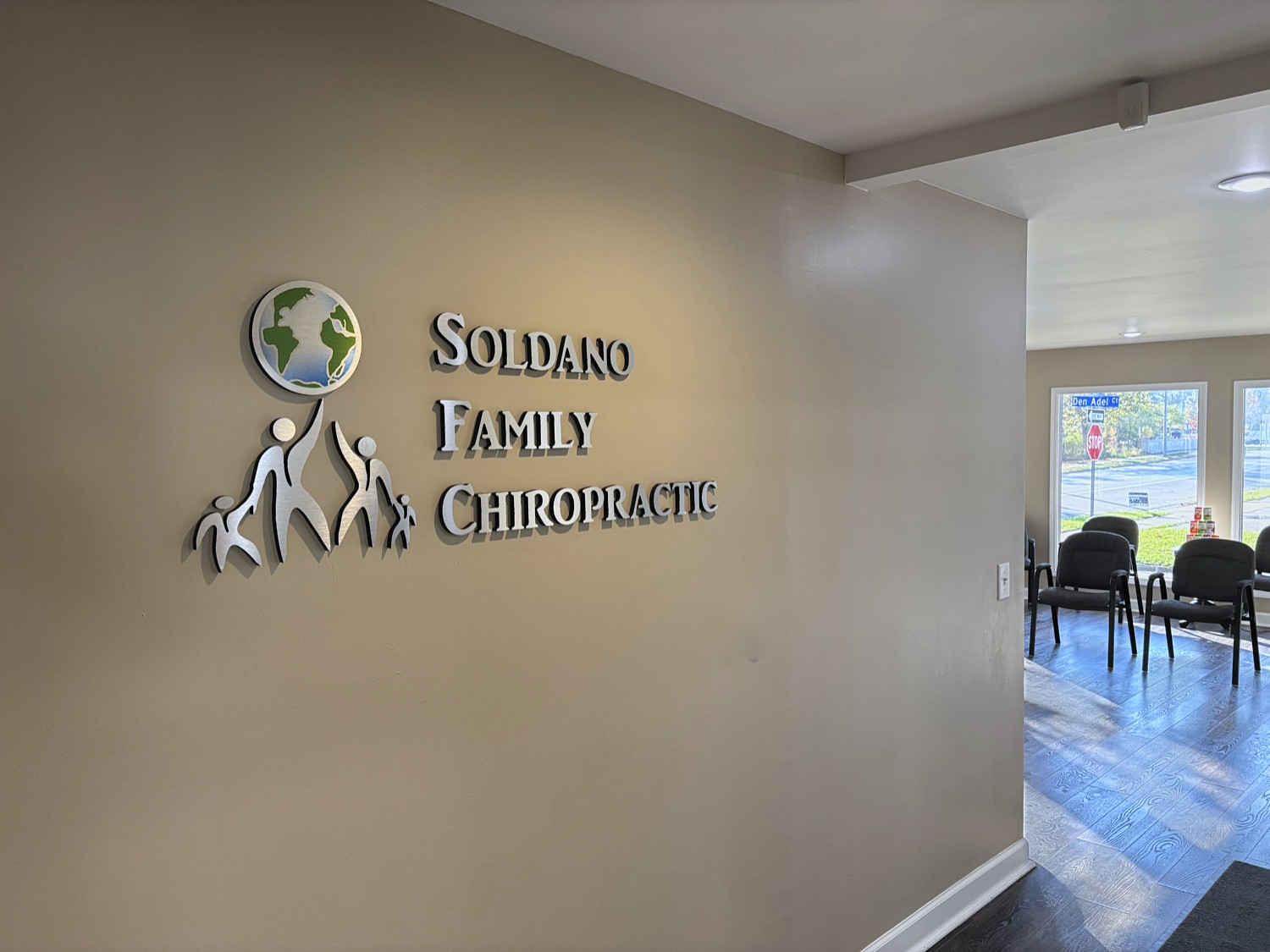 Front lobby and logo wall at Soldano Family Chiropractic Center in Kalamazoo